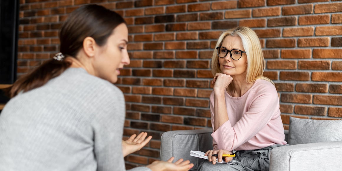 Chemical dependency counselor assistant speaking with client