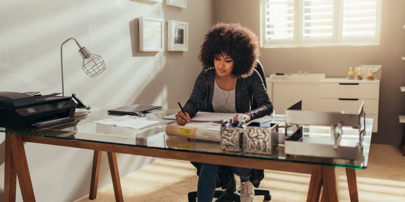 woman sitting at desk working from home ready for online learning